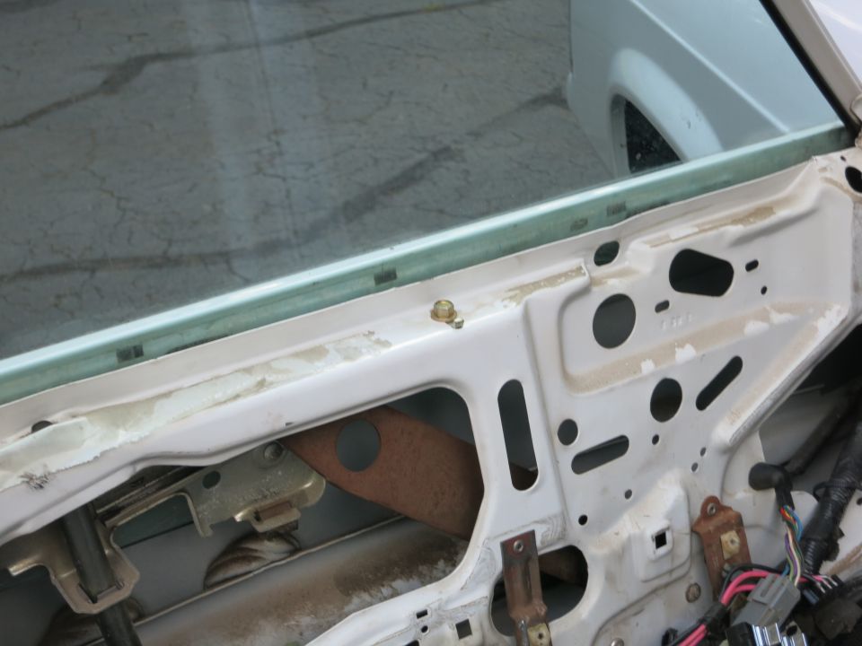Car door interior showing window mechanism and wiring