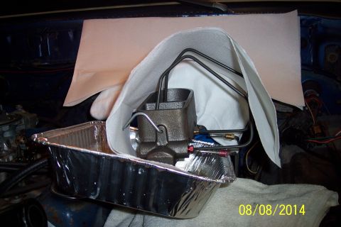 1978 Ford Bronco - Master cylinder and brake lines being worked on, placed in a foil pan for fluid collection.