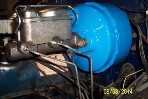 1978 Ford Bronco - Close-up of a vehicle's brake booster and master cylinder assembly.