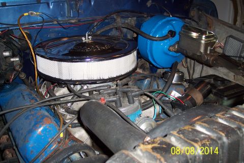 1978 Ford Bronco - Close-up view of an engine bay blue valve covers and a chrome air cleaner assembly.
