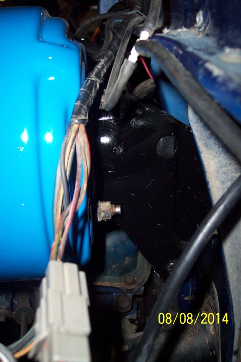 1978 Ford Bronco - Close-up view of engine bay components, including wiring and a black bracket, with a date stamp.