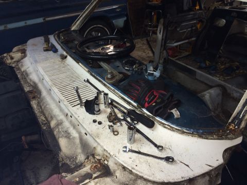 1964 Ford Fairlane - Disassembled 1964 Ford Fairlane interior dashboard with tools laid out for work.