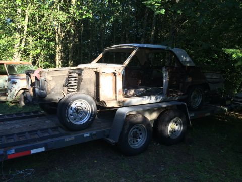 1964 Ford Fairlane - This 1964 Ford Fairlane body is being transported on a trailer, with its front end in pieces.