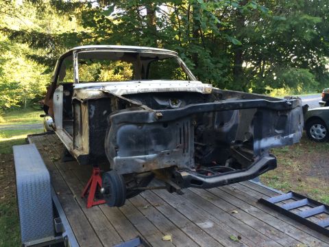 1964 Ford Fairlane - This 1964 Ford Fairlane body is being prepped for restoration on a trailer.