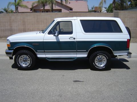 1996 Ford Bronco - This 1996 Ford Bronco is shown from the side, a two-tone white and green paint scheme.