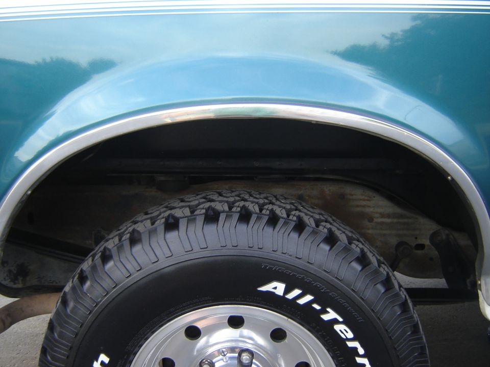 1996 Ford Bronco rear wheel well and tire with "All-Terrain" text
