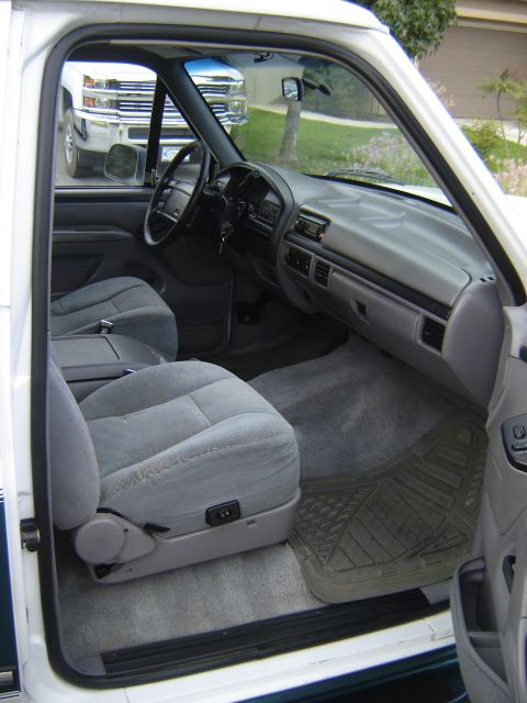 1996 Ford Bronco - Interior of a 1992 Ford Bronco, with another truck seen through the windshield.