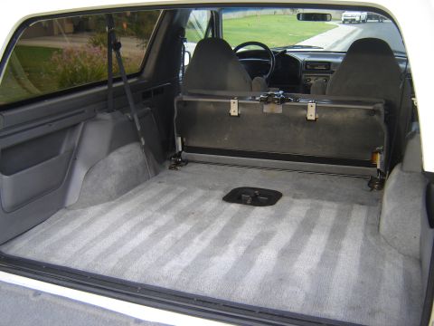 1996 Ford Bronco - View of the cargo space and front interior of a 1996 Ford Bronco.