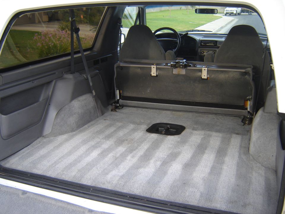 Interior cargo area and front seats of a 1996 Ford Bronco