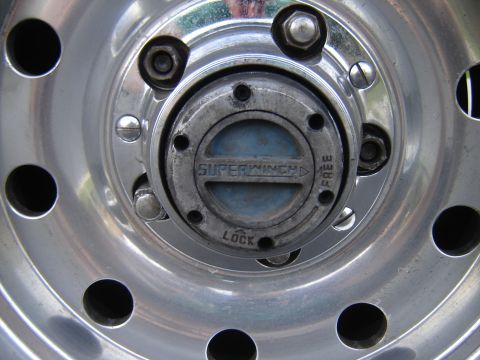1996 Ford Bronco - This close-up shows a wheel hub with a manual locking mechanism labeled 'Superwinch'.
