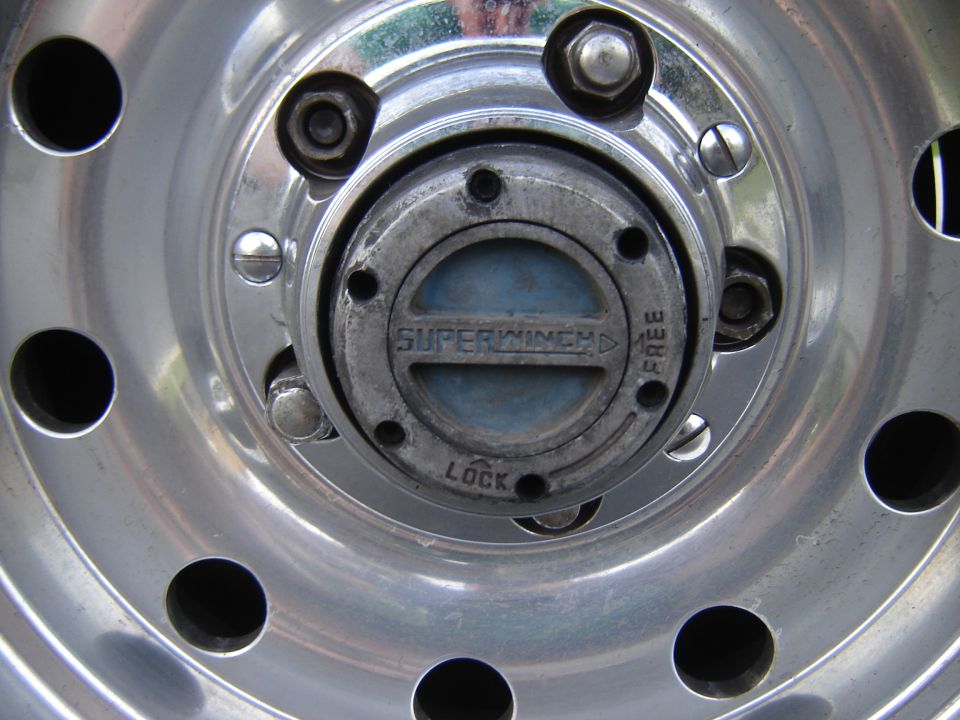 close-up of a wheel hub with a Superwinch locking mechanism