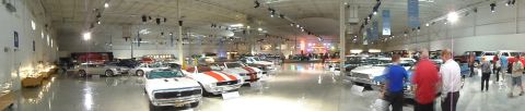 1971 Ford Ranchero - A panoramic view inside a museum, a diverse collection of automobiles from various eras.
