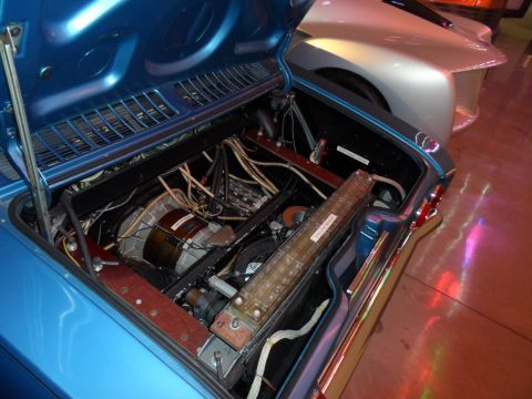 1971 Ford Ranchero - Engine bay of a blue car, with a silver car in the background.