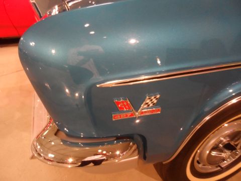 1971 Ford Ranchero - Close-up of a blue car's fender, a prominent '427' emblem with checkered flags, indicative of a 1967 model.