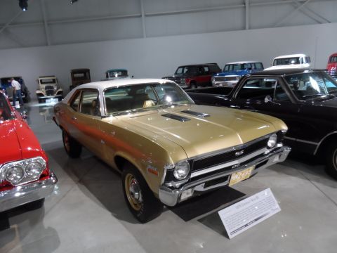 1971 Ford Ranchero - Gold 1970 Chevrolet Nova SS on display in a museum with other vehicles.