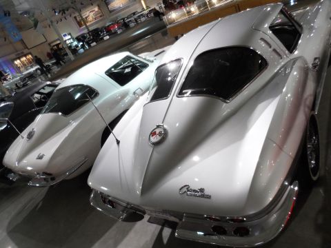 1971 Ford Ranchero - Two classic white Chevrolet Corvettes are displayed side-by-side in a museum setting.