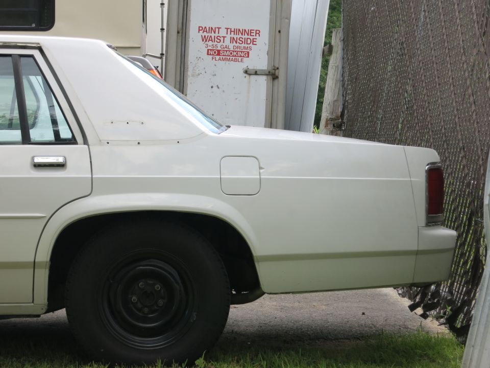 White 1991 Ford Crown Victoria LTD side view