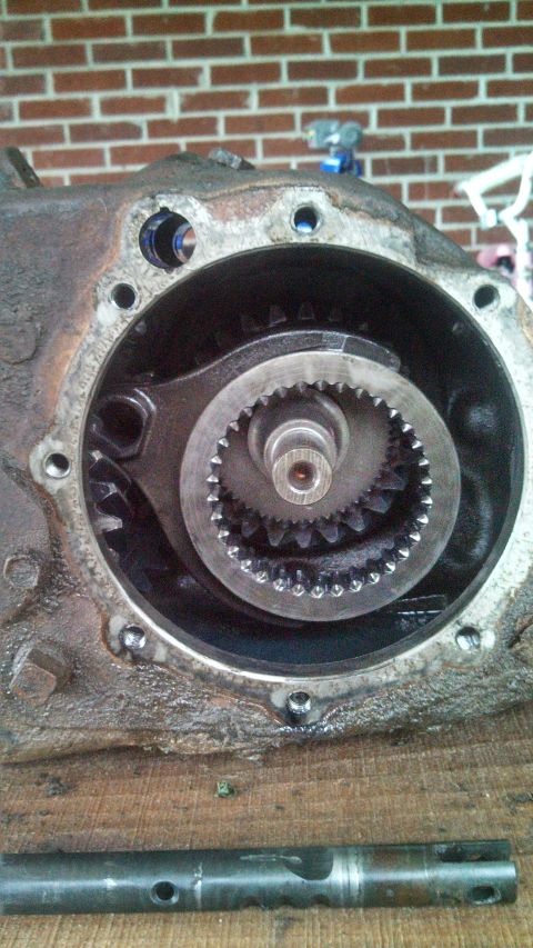 1979 Ford Bronco - Internal gears of a vehicle transfer case are shown, with a website logo at the bottom.