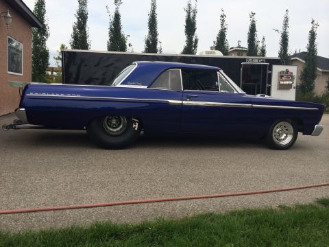1965 Ford Fairlane - Side view of a modified 1965 Ford Fairlane drag car, large rear slicks and a custom interior.