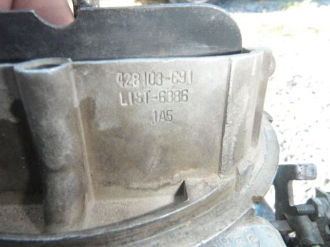 1972 International Scout II - Carburetor part with stamped identification numbers visible.