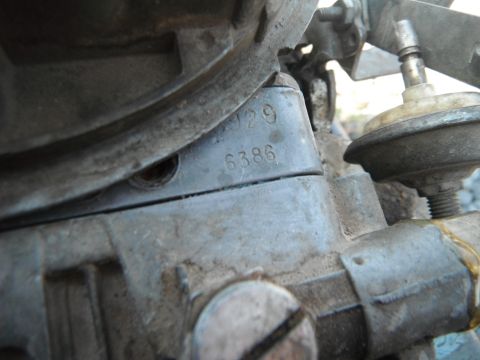 1972 International Scout II - Close-up of a carburetor showing stamped identification numbers.