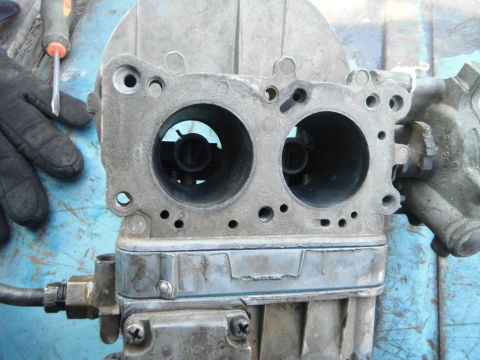 1972 International Scout II - A close-up view of a carburetor, showing its internal components and intake ports.