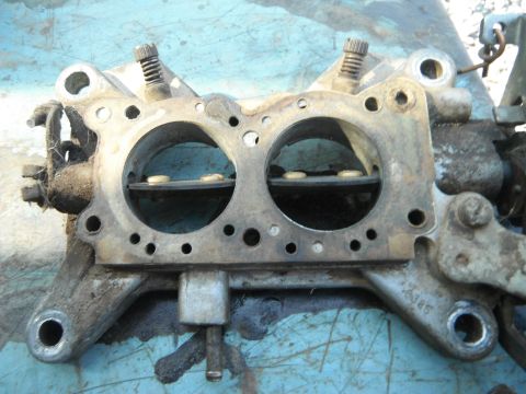 1972 International Scout II - This is a close-up view of a carburetor, a critical component for fuel delivery in older vehicles.