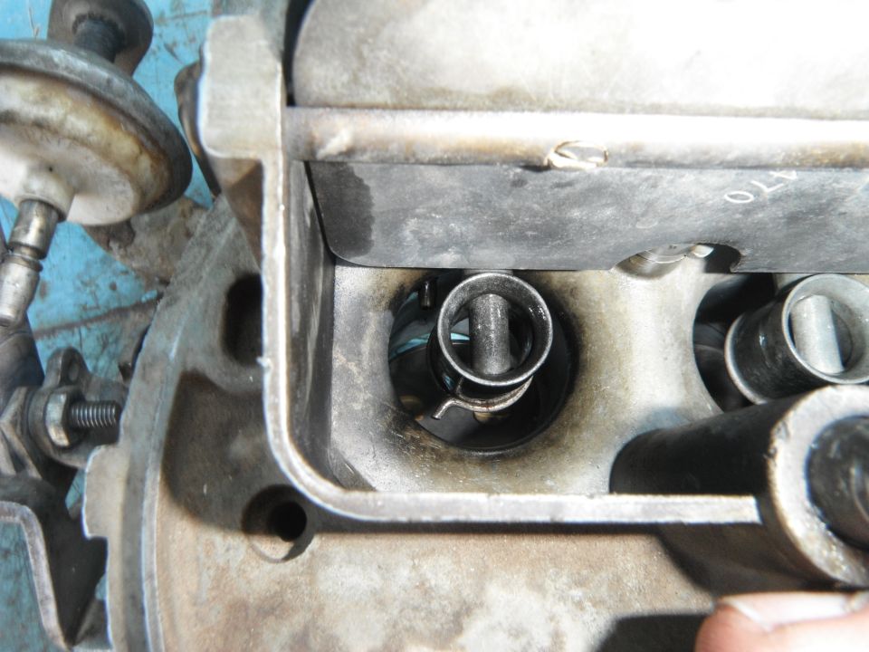 Carburetor interior with visible spring and valve stem