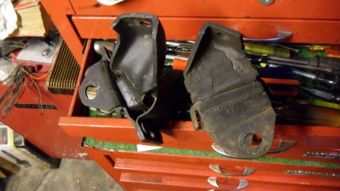 1972 Ford Ranchero - Two engine mounts are shown, one exhibiting significant cracking and wear. A part number is visible on one of the mounts.