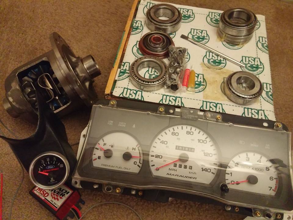 Car parts: differential, bearings, instrument cluster labeled Marauder, and an MSD ignition box