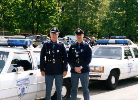 1991 Ford LTD Crown Victoria - Massachusetts Registry of Motor Vehicles officers stand with their patrol cars, identified as 1991 Ford Crown Victoria LTDs.