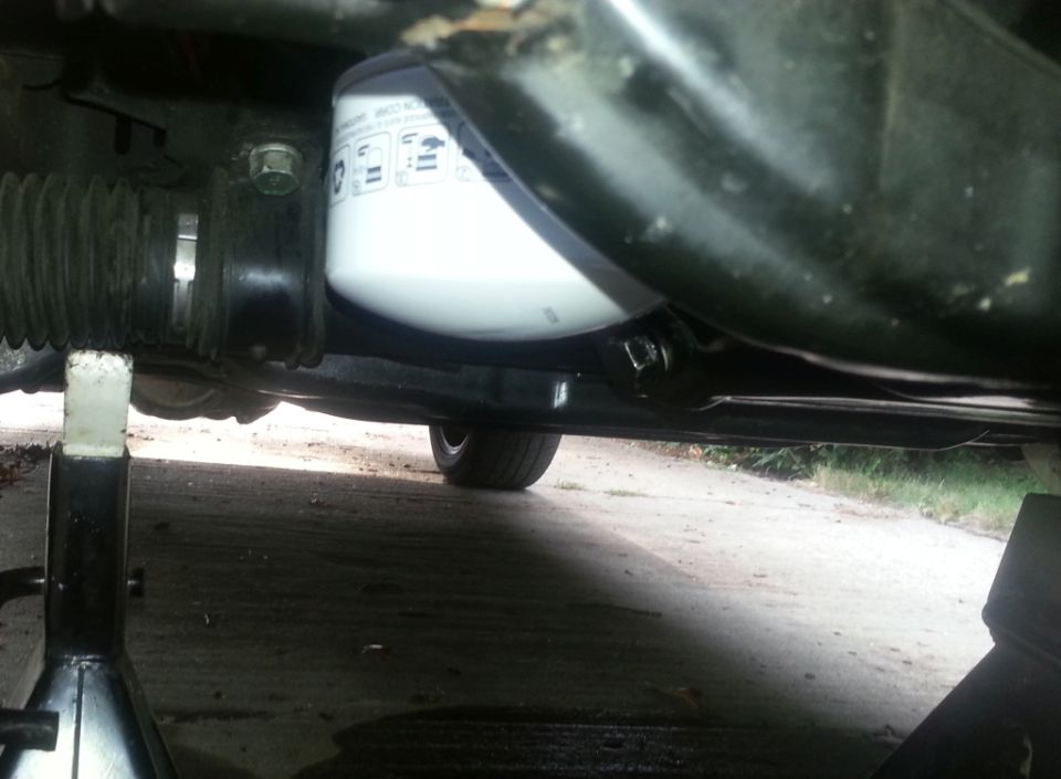 Oil filter and steering rack assembly on a vehicle supported by jack stands