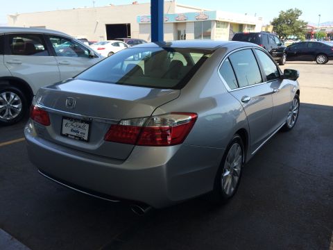 2014 Honda Accord - Rear 3/4 view of a silver 2014 Honda Accord sedan parked outdoors.