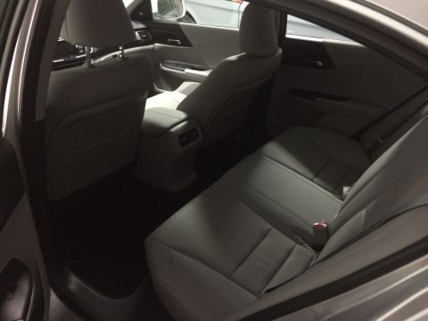 2014 Honda Accord - Rear interior view of a 2014 Honda Accord, showing the seats and door trim.