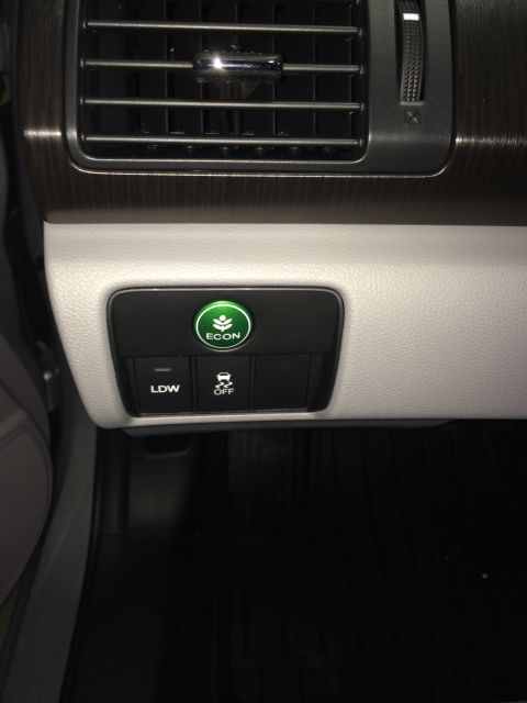 2014 Honda Accord - This image shows the interior dashboard controls of a vehicle, including the ECON mode button and traction control settings.