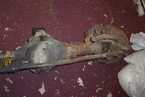 1996 Ford Bronco - This is a rusted rear axle assembly with brake components.