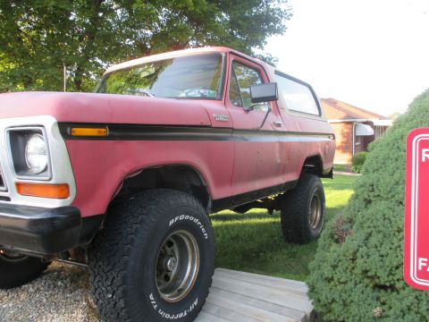 1979 Ford Bronco - This lifted Ford Bronco has a red body and a white roof, with BFGoodrich All-Terrain T/A tires.