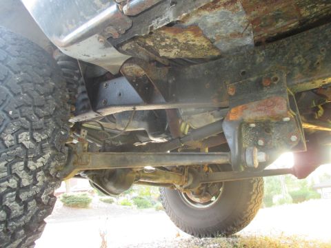 1979 Ford Bronco - The undercarriage of this 4x4 shows extensive rust on the frame and suspension components.