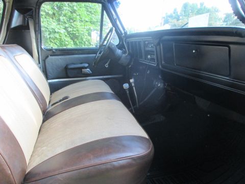 1979 Ford Bronco - Interior view of a 1979 Ford Bronco, highlighting the distinctive two-tone seat upholstery.