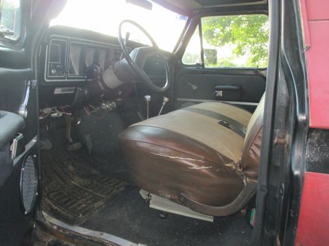 1979 Ford Bronco - The interior of a 1979 Ford Bronco features a two-tone seat and a classic dashboard layout.