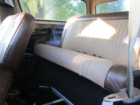 1979 Ford Bronco - Interior view of a 1979 Ford Bronco, highlighting the seating and carpet.