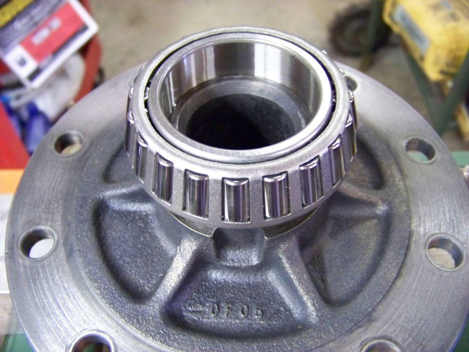 Differential bearing on a metal flange with "-0F09" stamped on it