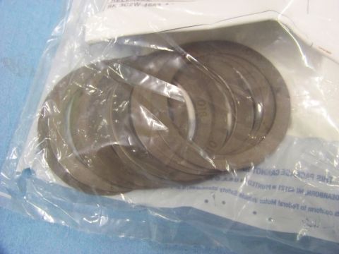 1999 Mercury Grand Marquis - A package of differential shims is shown, with some text visible on the packaging and the shims themselves.