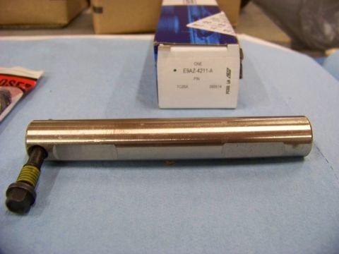 1999 Mercury Grand Marquis - A metal part with a bolt is shown next to its packaging, which has the part number E9AZ-4211-A printed on it.