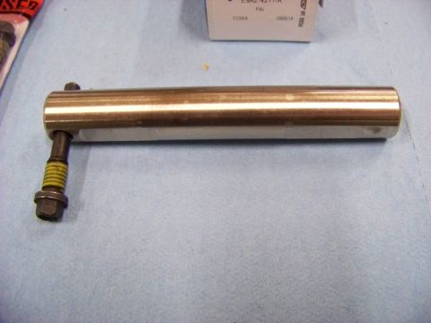 1999 Mercury Grand Marquis - A metal part, possibly a component for a differential rebuild, is shown against a blue background.