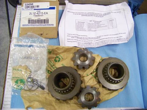 1999 Mercury Grand Marquis - A differential pinion kit is laid out with its components and instructions for installation.