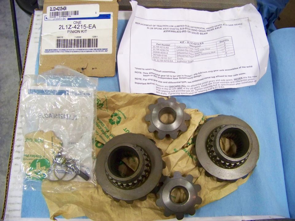 Differential gear kit with pinion and side gears, seals, and instructions