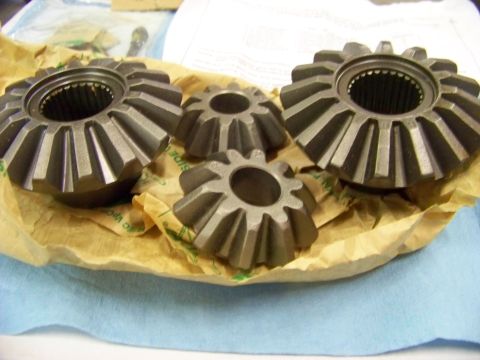 1999 Mercury Grand Marquis - A set of differential gears, likely for a vehicle's drivetrain, are presented for inspection.