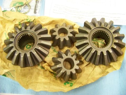 1999 Mercury Grand Marquis - Differential gears are laid out on yellow paper, with some text visible in the background.