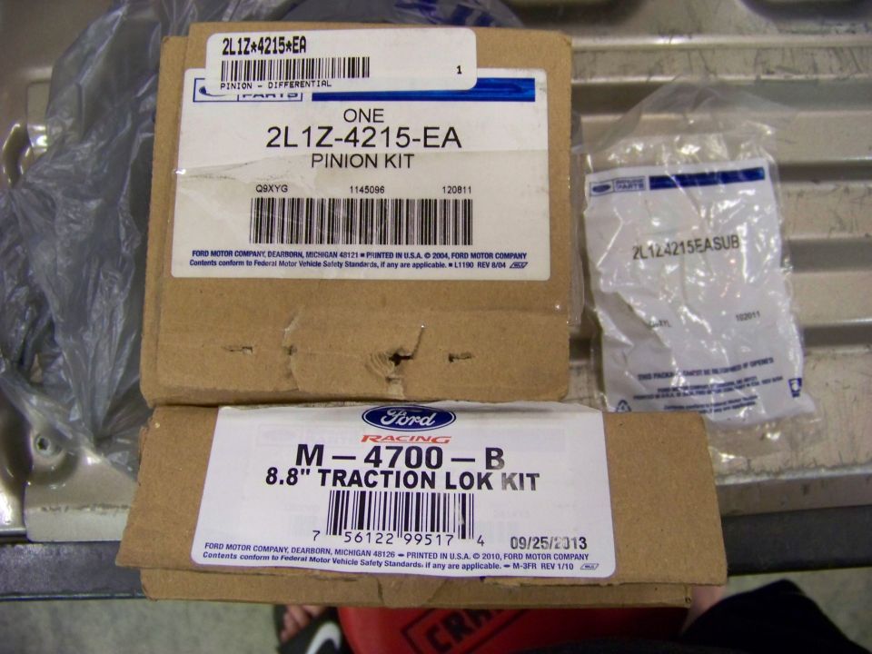 Two Ford Racing differential and traction lok kits, one labeled 2L1Z-4215-EA Pinion Kit, the other M-4700-B 8.8" Traction Lok Kit